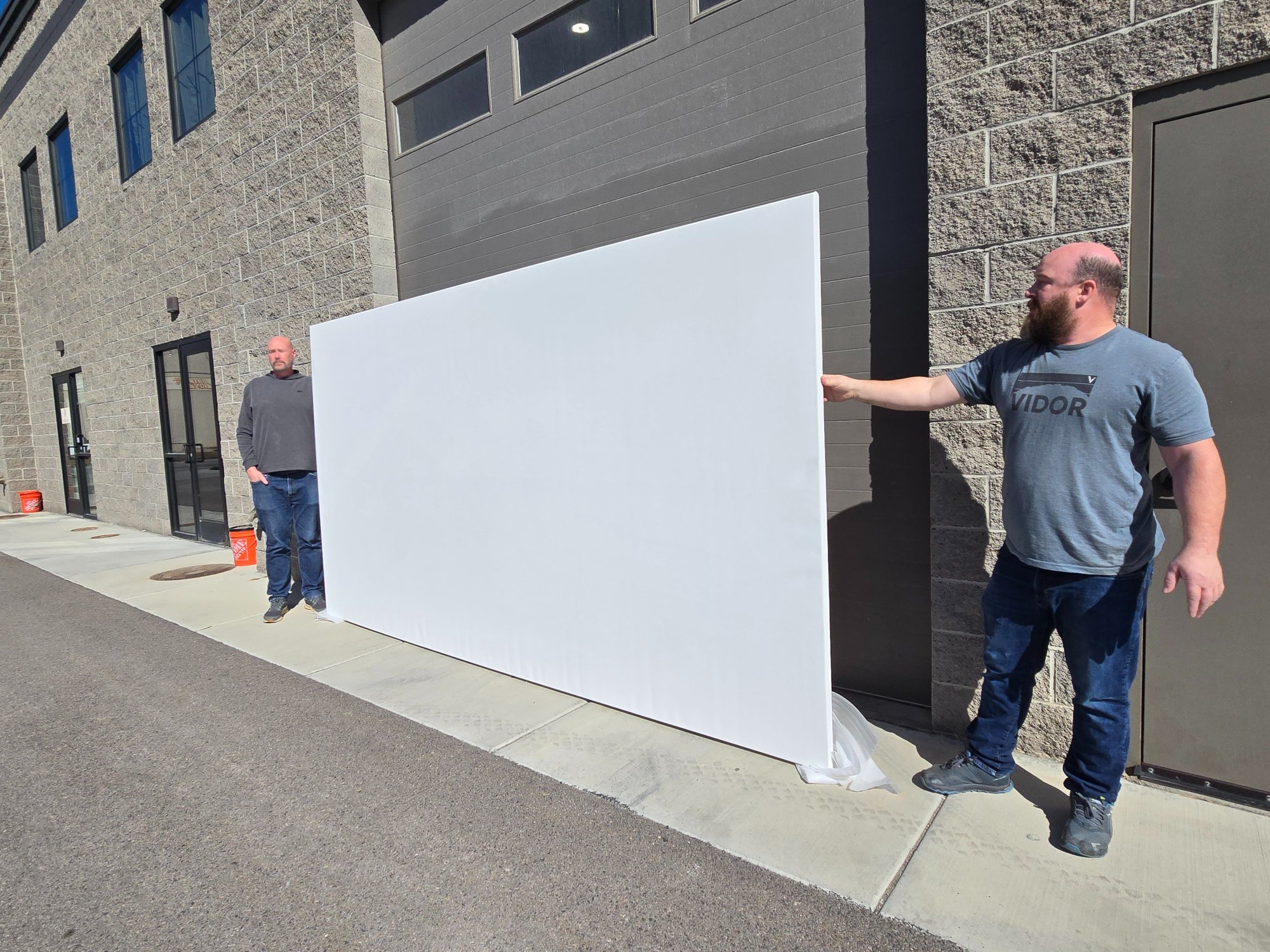 Angled view showing the massive scale of a blank canvas